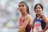 圧巻の走りをみせた田中。大会６連覇を飾りタイムを確認する。写真：永島裕基
