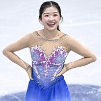 可憐な笑顔が印象的な中井。帰国後はテレビ出演に引っ張りだこだ。C)Getty Images