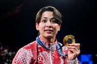 五輪金メダリストの出口クリスタが学生時代の写真を公開。(C)Getty Images