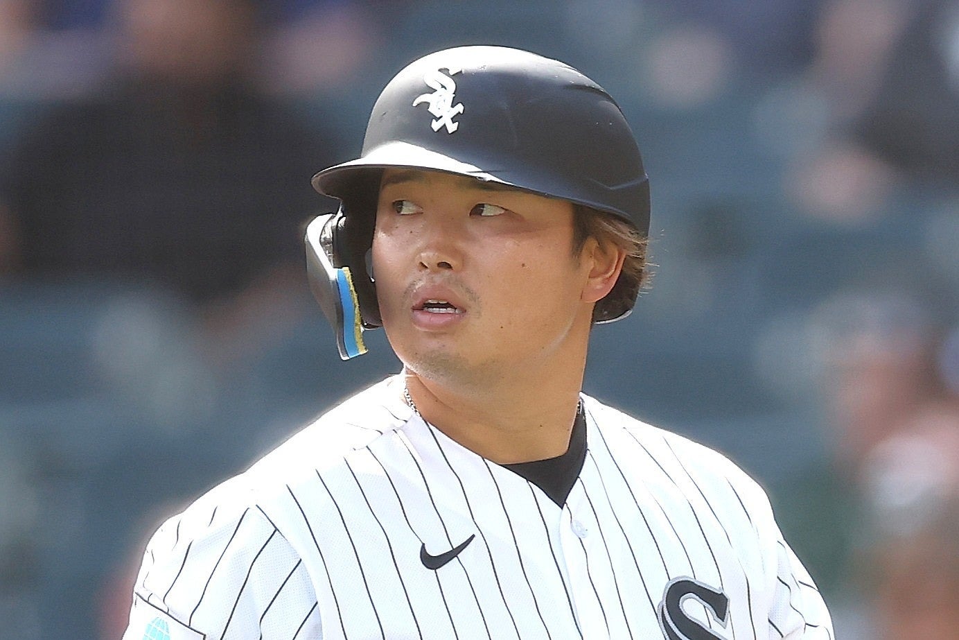 ベルトに“臥薪嘗胆”と縫い付けている村上。(C)Getty Images